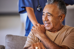 patient with hand on shoulder